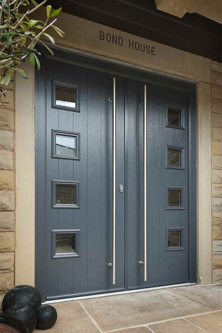 Bond house double grey doors with long silver handle bars