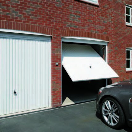 Car entering garage with white door
